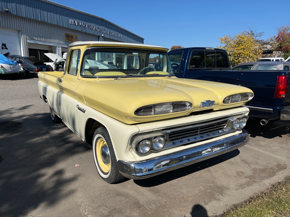 1960 Chevrolet Apache painted yellow & white front view. Yellow & white classic truck