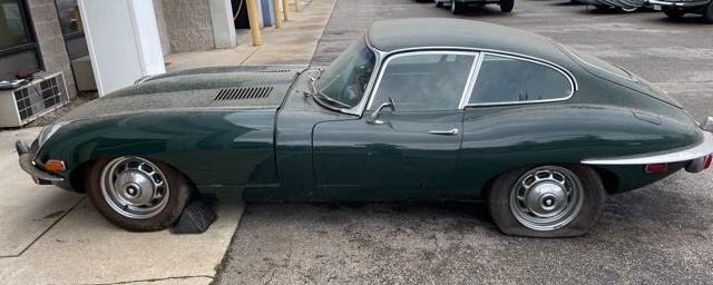 1969 Jaguar XKE green side view before Black Wolf Auto restoration