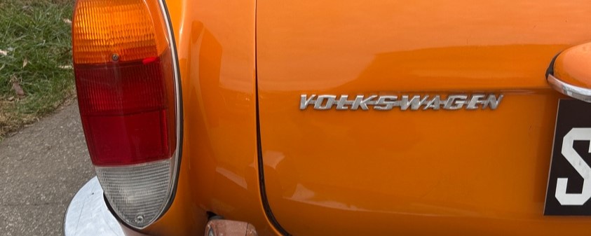 1973 Karmann Ghia Volkswagen logo bright orange