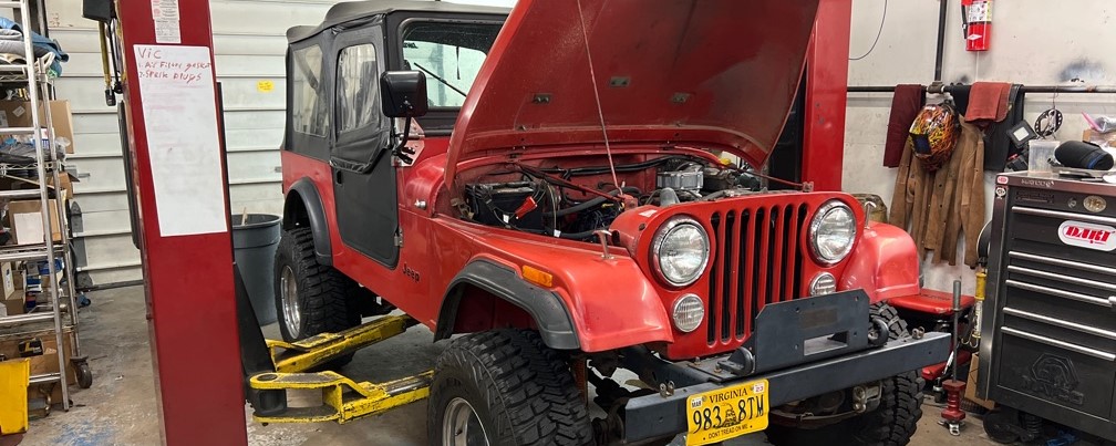 1986 Jeep CJ7 red front view restoration at Black Wolf Automotive Specialties